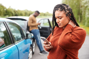 Women suffering from neck pain after a car accident